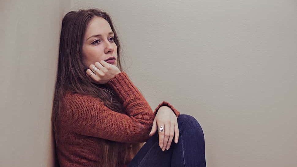 Calm person practicing deep breathing to manage anxiety and stress